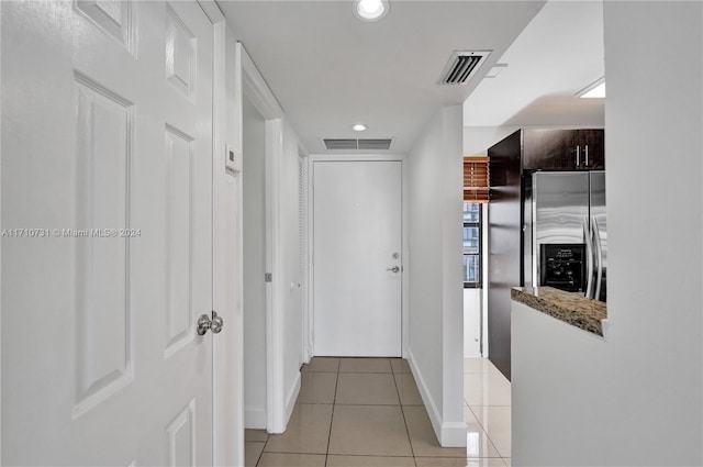 hallway with light tile patterned flooring