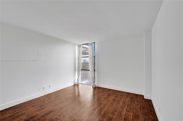 empty room featuring hardwood / wood-style flooring