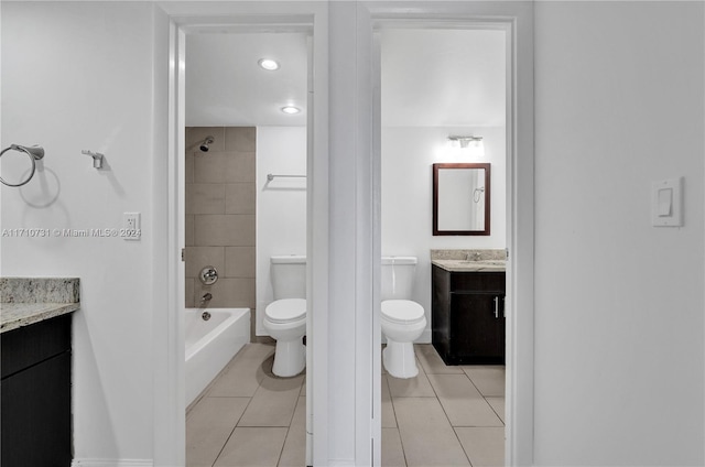 full bathroom with tile patterned flooring, vanity, toilet, and tiled shower / bath combo