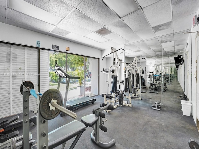 exercise room featuring a drop ceiling