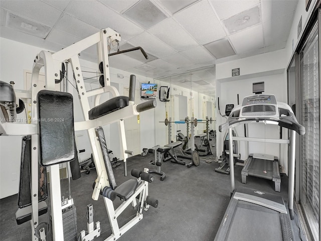 workout area featuring a drop ceiling