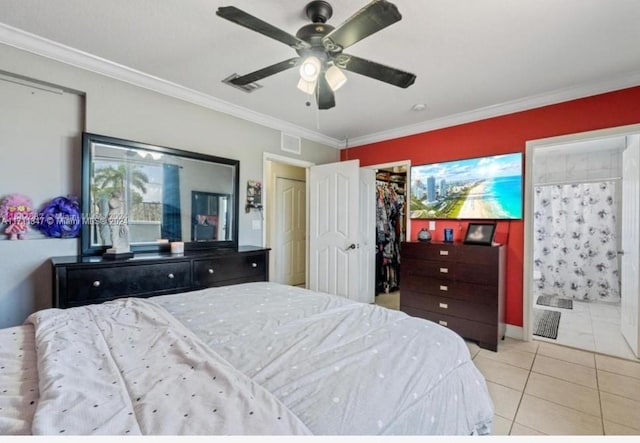 bedroom featuring ceiling fan, light tile patterned floors, and crown molding