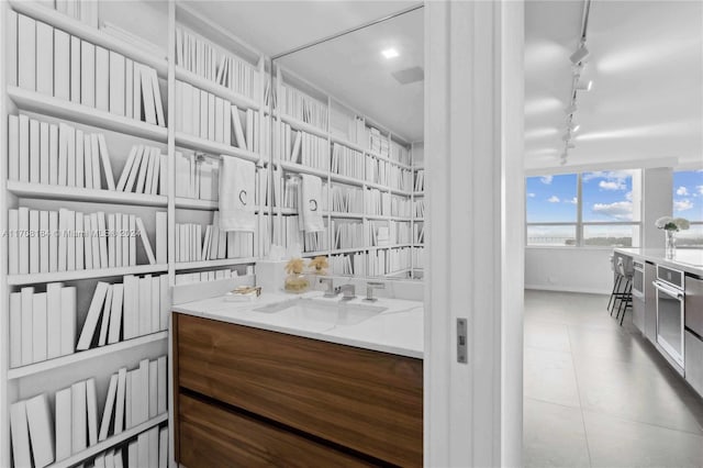 bathroom with sink and track lighting