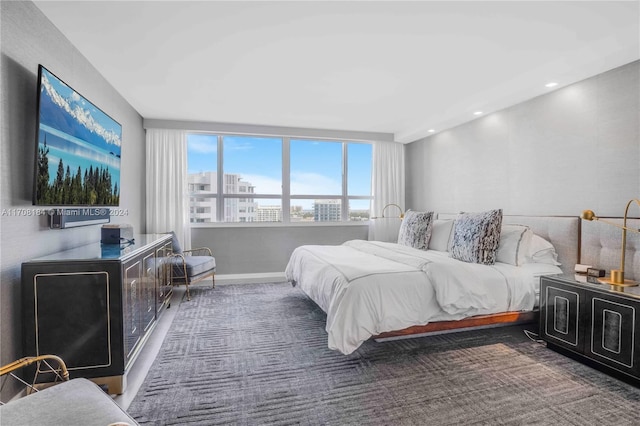 bedroom featuring dark colored carpet