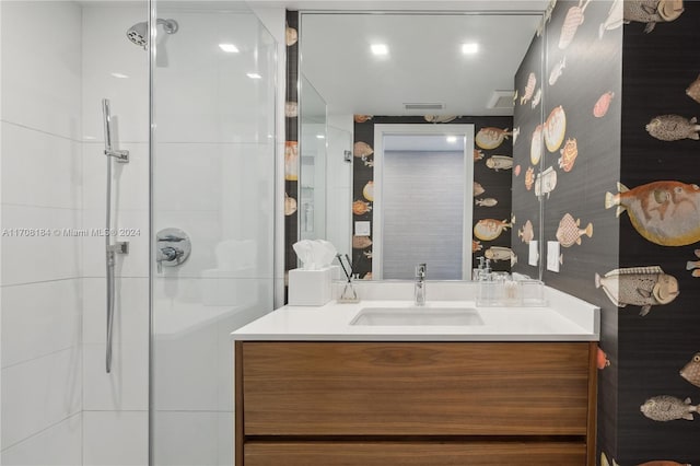 bathroom featuring vanity and an enclosed shower