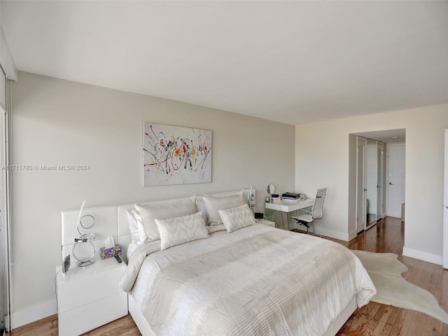 bedroom featuring hardwood / wood-style floors