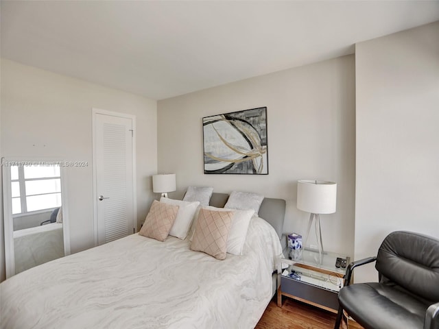 bedroom with hardwood / wood-style floors