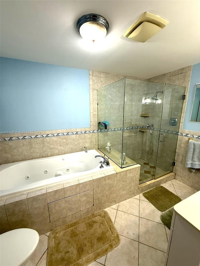 bathroom featuring tile patterned flooring and independent shower and bath