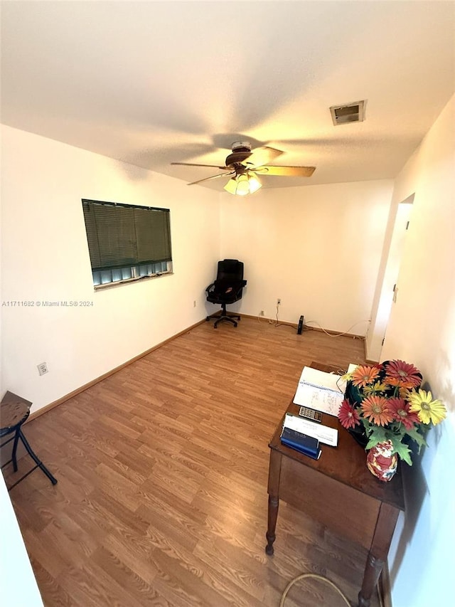 miscellaneous room featuring ceiling fan and hardwood / wood-style floors