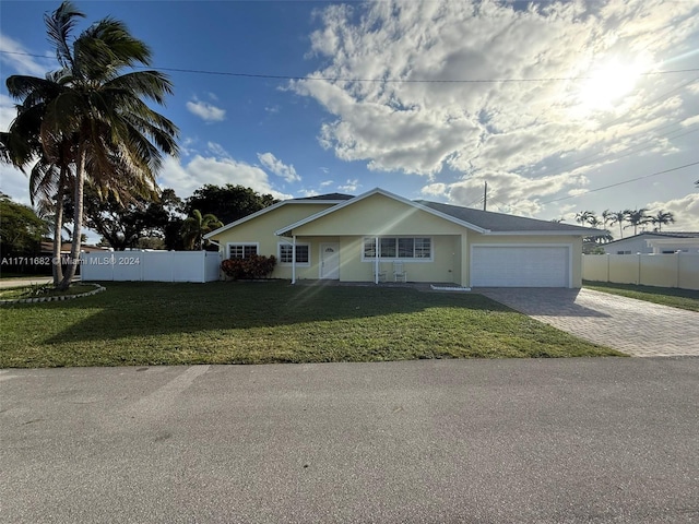 view of front facade featuring a garage and a front yard