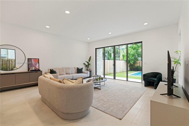 909 NE 16th Ave, Fort Lauderdale, FL 33304 - living room with recessed lighting and light tile patterned floors