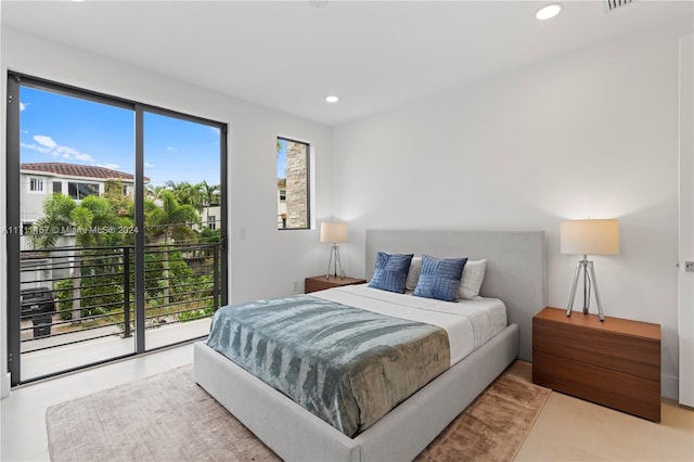 bedroom featuring access to exterior and tile patterned floors