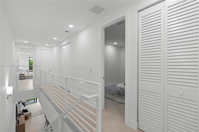 909 NE 16th Ave, Fort Lauderdale, FL 33304 - hallway featuring an upstairs landing and recessed lighting