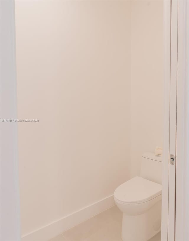 bathroom with tile patterned floors and toilet