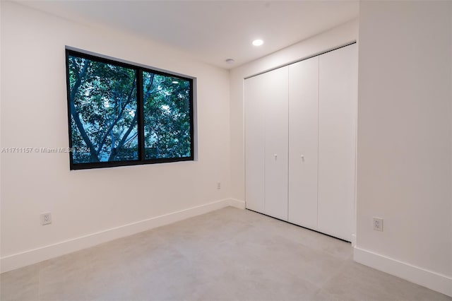 unfurnished bedroom with a closet