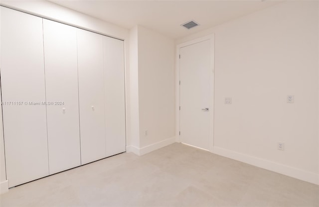 unfurnished bedroom featuring a closet