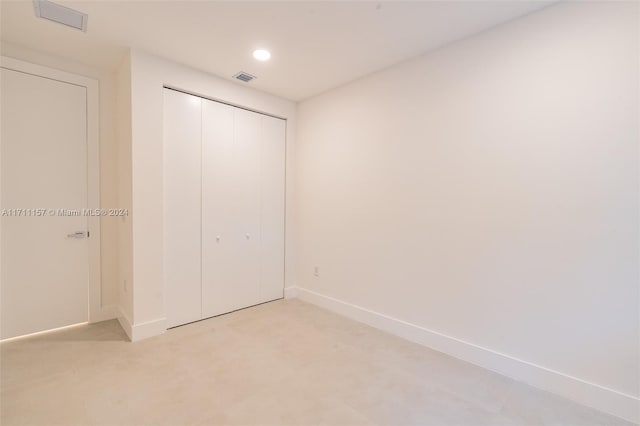 unfurnished bedroom with a closet