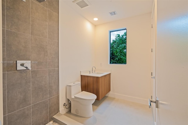 bathroom with tile patterned floors, vanity, and toilet