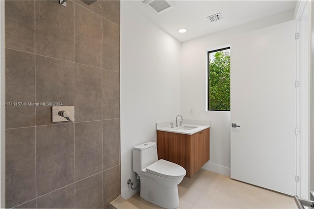 bathroom with vanity, toilet, and walk in shower