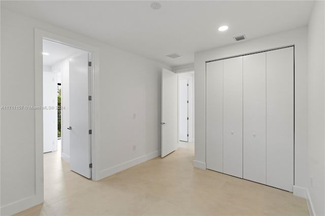 unfurnished bedroom with a closet