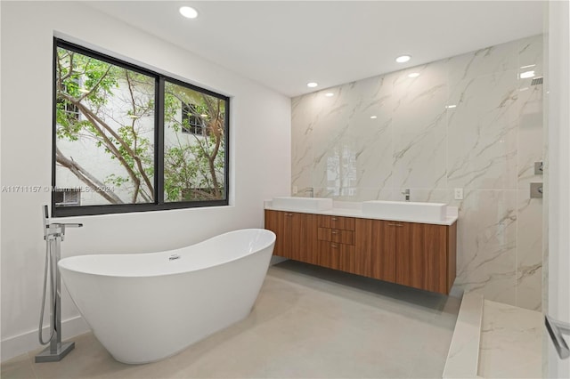 bathroom featuring a tub and vanity