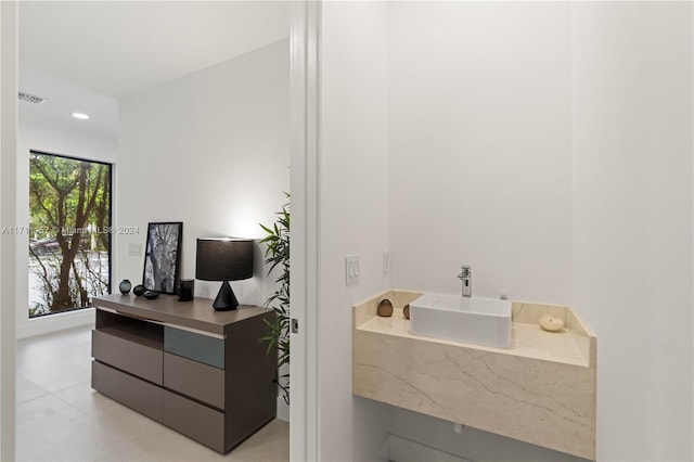 bathroom featuring plenty of natural light, vanity, and tile patterned flooring