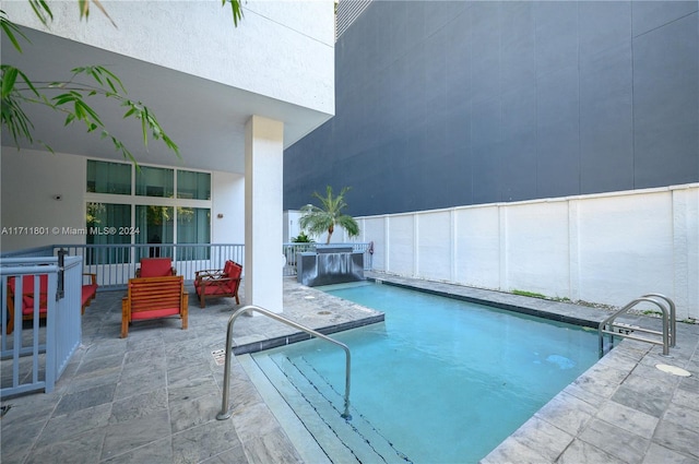 view of swimming pool featuring a patio