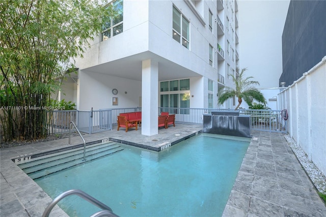 view of swimming pool with an outdoor hangout area and a patio