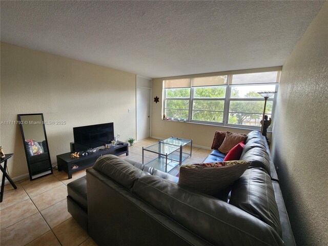 tiled living room with a textured ceiling