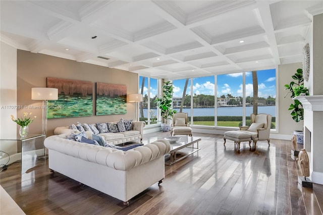 living room featuring coffered ceiling, beam ceiling, dark wood-type flooring, and a water view