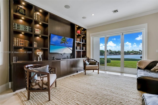 living room featuring crown molding and built in shelves