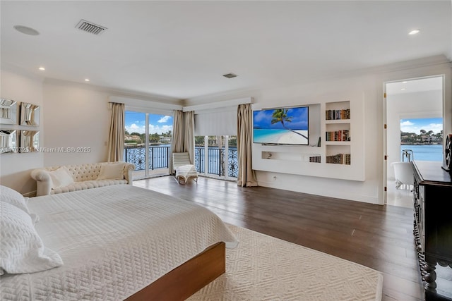 bedroom featuring wood-type flooring, access to outside, and crown molding