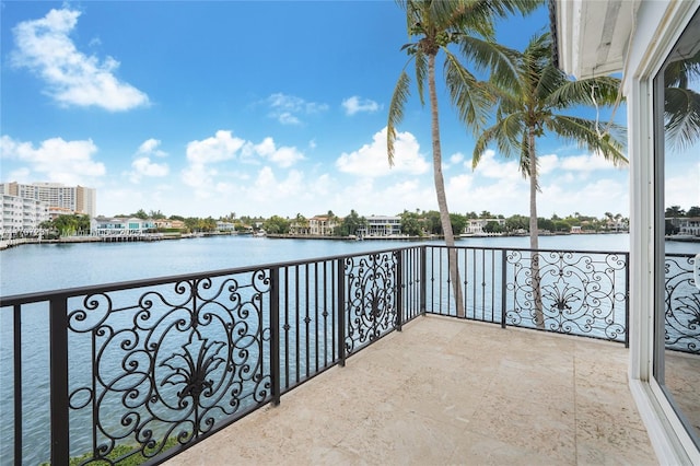 balcony featuring a water view