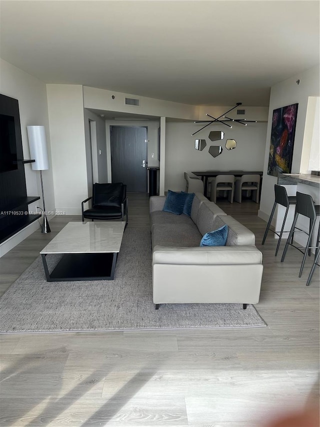 living room with light hardwood / wood-style flooring