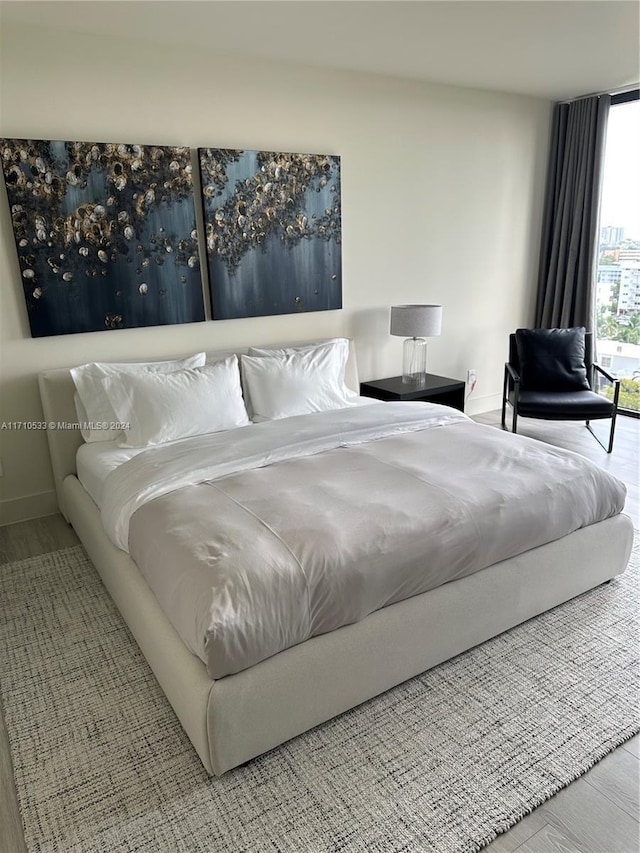 bedroom with hardwood / wood-style flooring