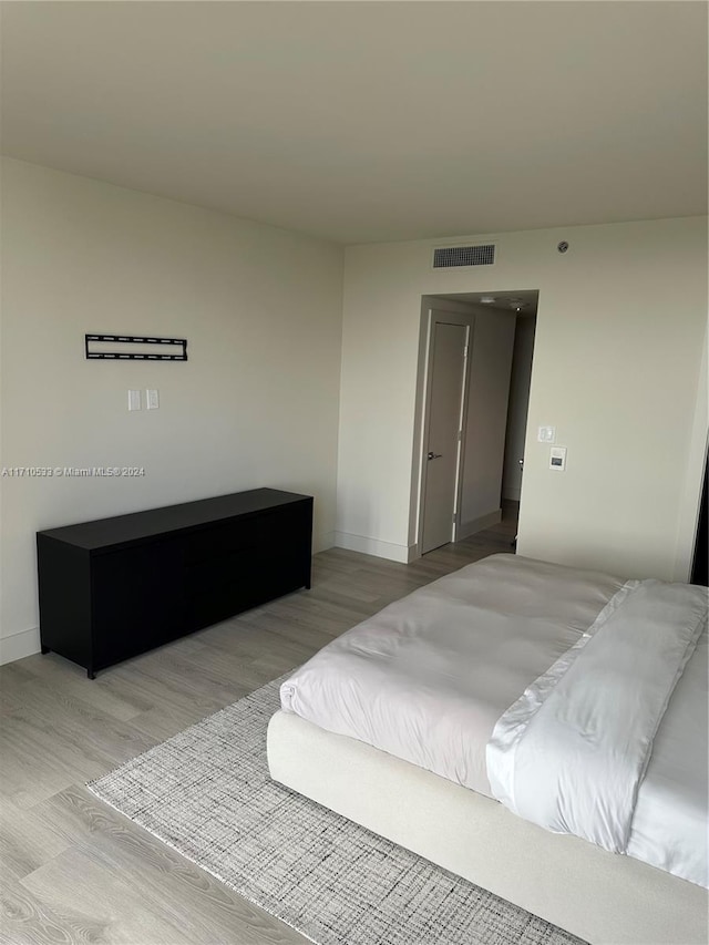 bedroom with light wood-type flooring