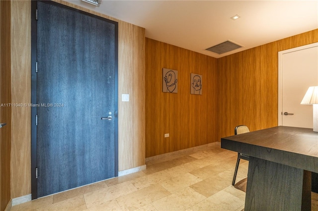 office featuring wooden walls