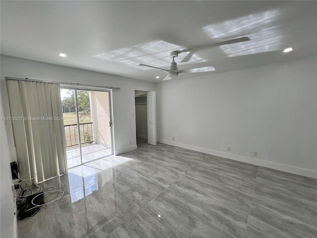 unfurnished bedroom featuring ceiling fan and access to outside