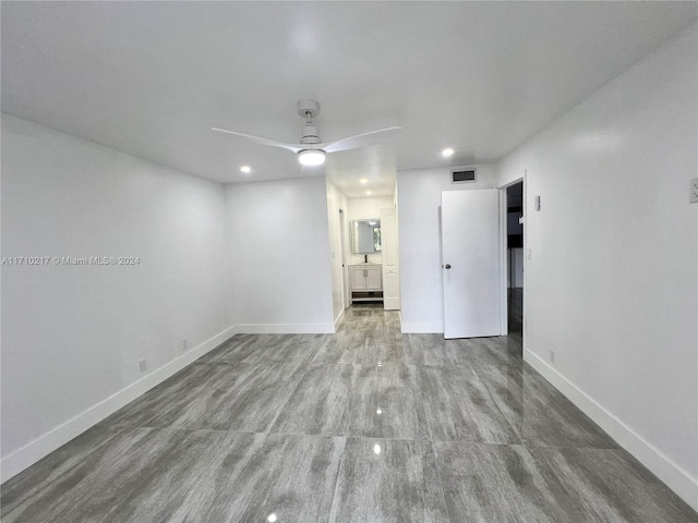 unfurnished room with ceiling fan and hardwood / wood-style floors