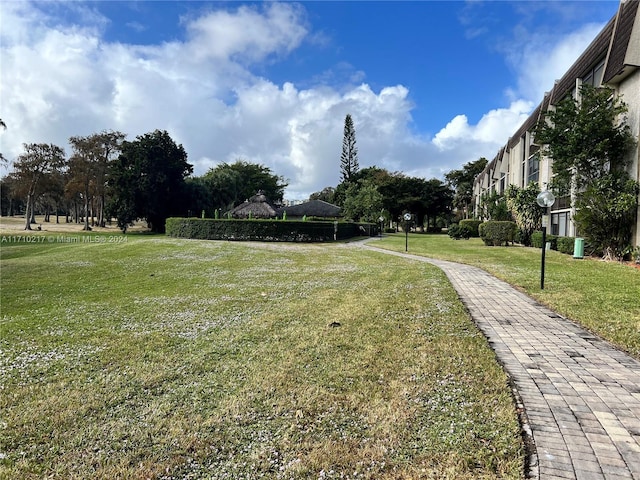 view of home's community featuring a lawn