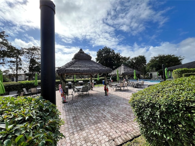 view of patio / terrace featuring a gazebo and a community pool