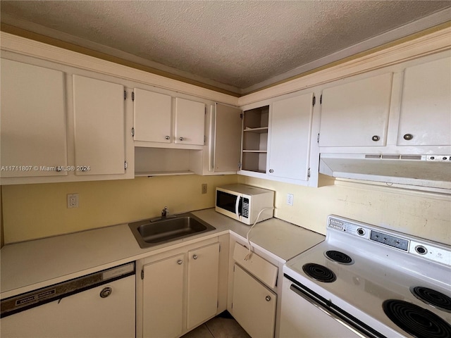 kitchen with sink, ventilation hood, tile patterned floors, a textured ceiling, and white appliances