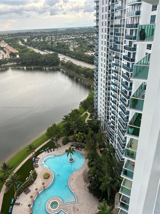 view of pool featuring a water view