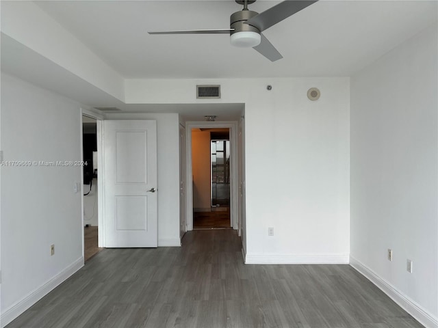 spare room featuring ceiling fan and wood-type flooring