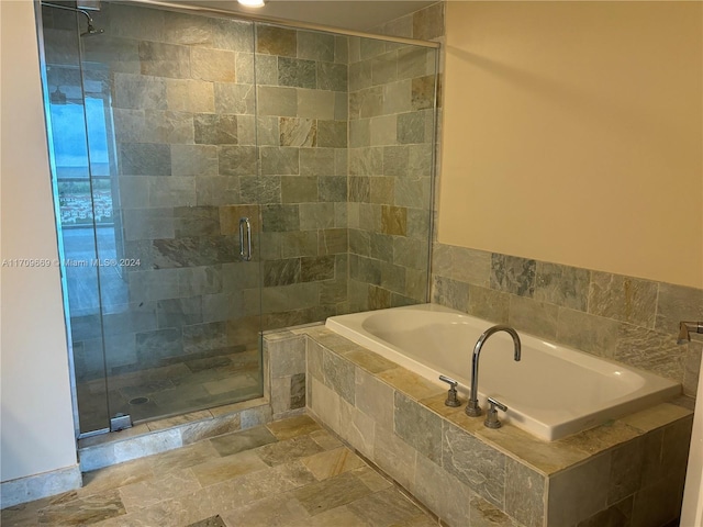 bathroom featuring plus walk in shower