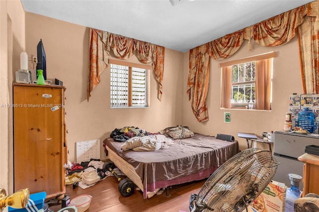 bedroom featuring wood-type flooring