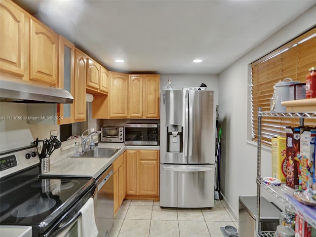 kitchen with light brown cabinets, light tile patterned floors, sink, and appliances with stainless steel finishes