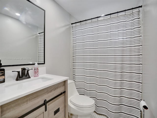 bathroom with walk in shower, vanity, and toilet