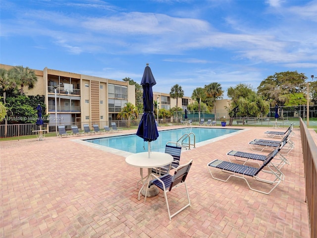 view of swimming pool with a patio area