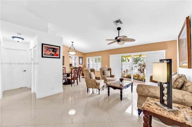 tiled living room with vaulted ceiling and ceiling fan